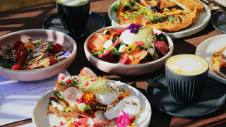 Farzi Hobart - colourful plates of food and coffees presented on a table